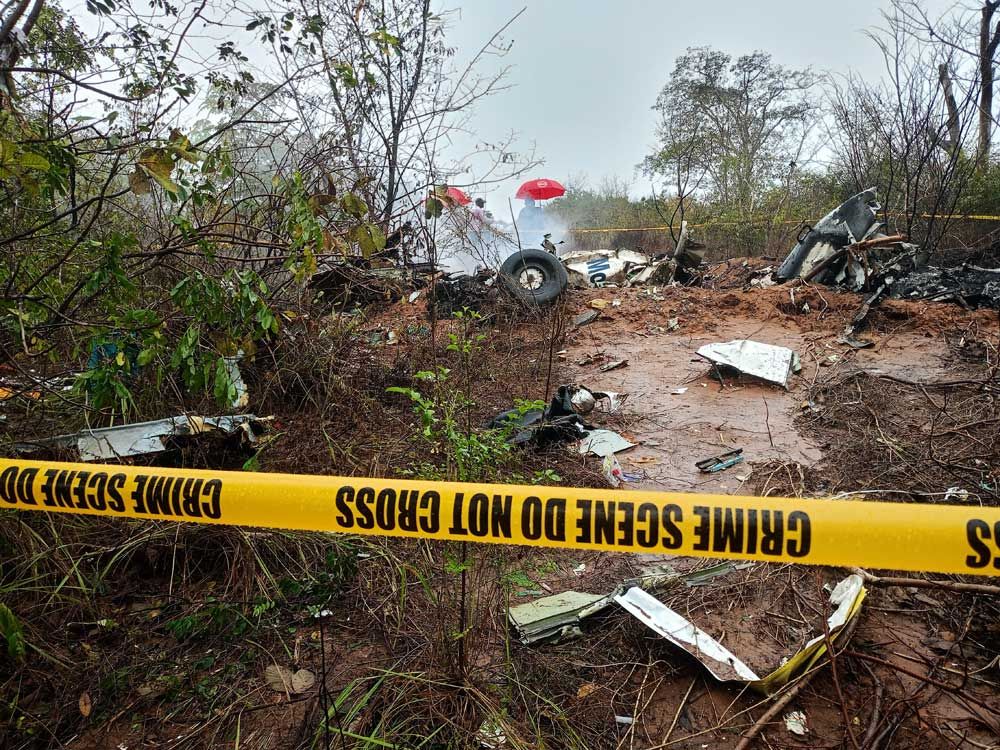 Kenyan officials inspect the site of a plane crash near Diani, Kenya, Tuesday, October 28, 2025.
