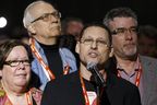 Delegate Avi Lewis (left) speaks in support of the Leap Manifesto during the 2016 Edmonton NDP National Convention at the Shaw Convention Center in Edmonton, Alta., on Sunday, April 10, 2016.