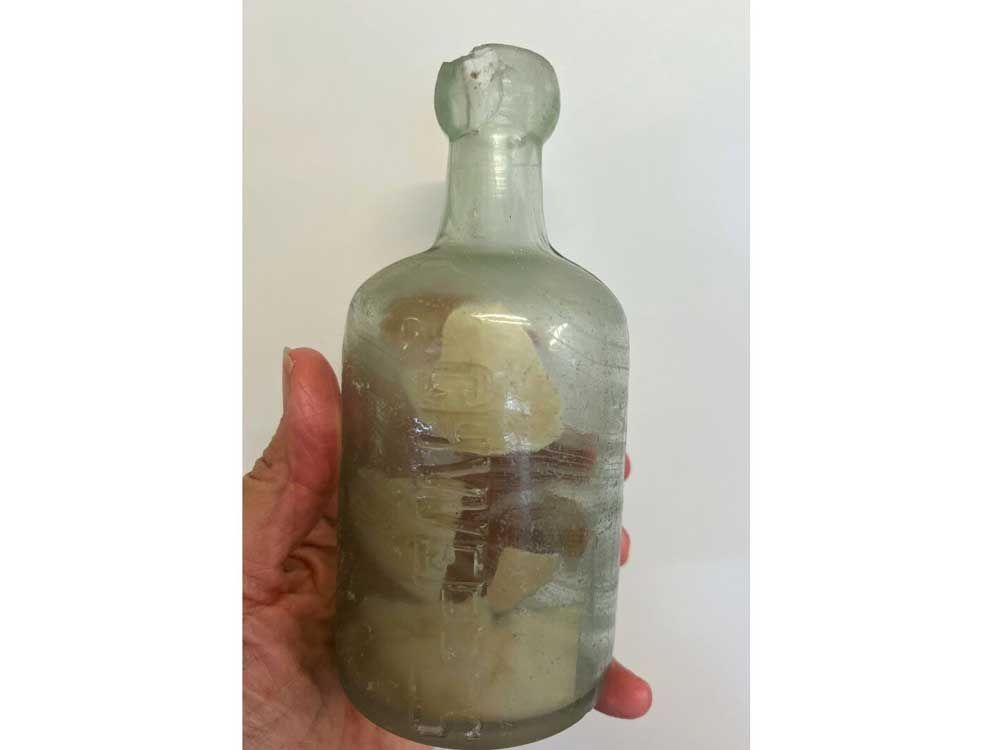 This photo provided by Deb Brown shows a bottle with letters inside in Condingup, Australia, Saturday, October 25, 2025.