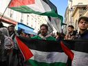The protesters and relatives of French citizens who took part in flotillas carrying missing activists and assistance in Gaza and are still lingering in Israel-march with Palestinian flags towards the Matignon Hotel, the official residence of the Prime Minister of the French Prime Minister, during a wipit in Paris on October 5, 2025.