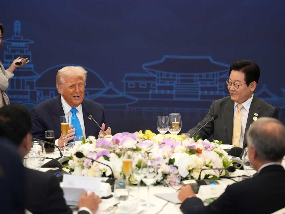 South Korean President Lee Jae-myung (top right), Canadian Prime Minister Mark Carney (bottom right) and Singapore Prime Minister Lawrence Wong (bottom left) listen to U.S. President Donald Trump (top left) speak during a dinner in his honor at the Hilton Gyeongju on October 29, 2025 in Gyeongju, South Korea.
