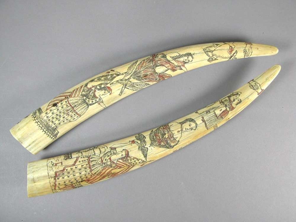 This undated photo provided by the Oakland Museum of California Thursday, Oct. 30, 2025, shows a pair of scrimshaw tusks by an unidentified artist at the Oakland Museum of California, in Oakland, Calif.  This undated photo provided by the Oakland Museum of California Thursday, Oct. 30, 2025, shows a pair of scrimshaw tusks by an unidentified artist at the Oakland Museum of California, in Oakland, Calif.