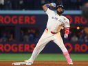 Vladimir Guerrero Jr. of the Toronto Blue Jays reacts to a double during Game 7 against the Los Angeles Dodgers.