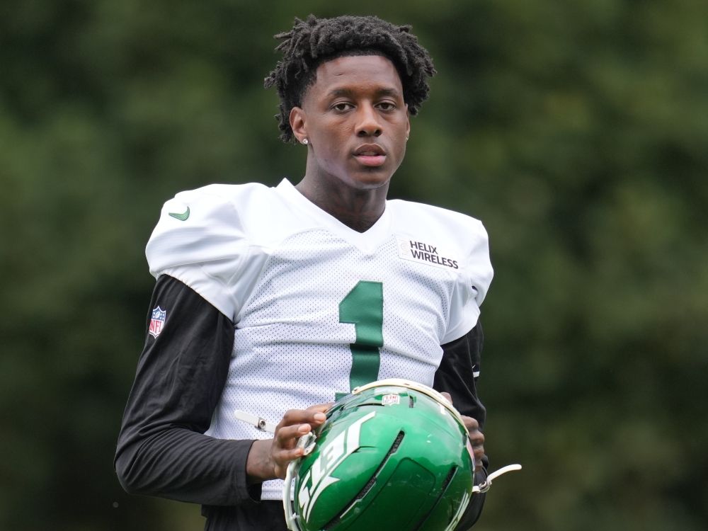 New York Jets defensive end Sauce Gardner watches the game during practice.