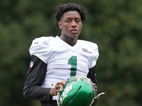 New York Jets defensive end Sauce Gardner watches the game during practice.