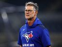 Toronto Blue Jays bench coach Don Mattingly takes the field during practice during the World Series.
