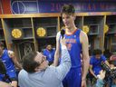Florida player Olivier Rioux, from Quebec, is interviewed in the locker room during media day at the NCAA Final Four earlier this year.