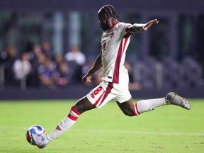Ismael Kone (Canada) prepares to kick the ball