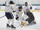 Toronto Skeptics goaltender Elaine Chuley makes a save against teammate Clara Van Wieren during PWHL training camp.