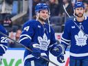 Scott Laughton of the Toronto Maple Leafs celebrates with his team after defeating the Utah Mammoth.