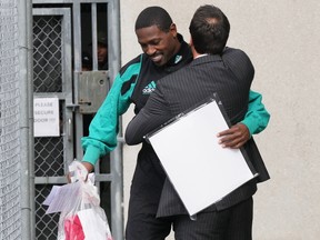 Former NFL star wide receiver Antonio Brown, left, greets his attorney Mark Russell Eiglarsh after being released from the Turner Guilford Knight Correctional Center on Nov. 13.