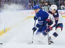 The Toronto Maple Leafs' Max Domi and Columbus Blue Jackets' Egor Chinakhov will battle for the puck during Thursday's game.