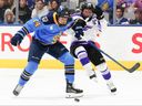 Toronto Skepres' Renata Fast, left, competes for the puck with Minnesota Frost's Kendall Coyne Schofield during a PWHL first-period playoff hockey game in Toronto on May 7, 2025.