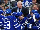 Toronto Maple Leafs head coach Craig Berube talks to his players during a timeout.