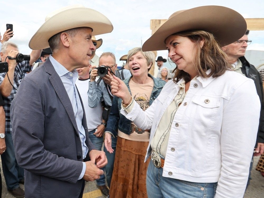  Prime Minister Mark Carney meets with Alberta Premier Danielle Smith during a Stampede breakfast at the United Brotherhood of Carpenters and Joiners of America in Calgary on July 4.