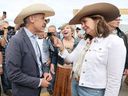 Prime Minister Mark Carney meets with Alberta Premier Danielle Smith during a Stampede breakfast at the United Brotherhood of Carpenters and Joiners of America in Calgary on July 4.
