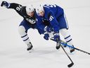 Toronto Maple Leafs forward John Tavares (91) battles defenseman William Villeneuve (76) for the puck during training camp.