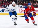 Sammy Blais of the Toronto Maple Leafs skates against Jake Evans of the Montreal Canadiens during a game on November 22, 2025.