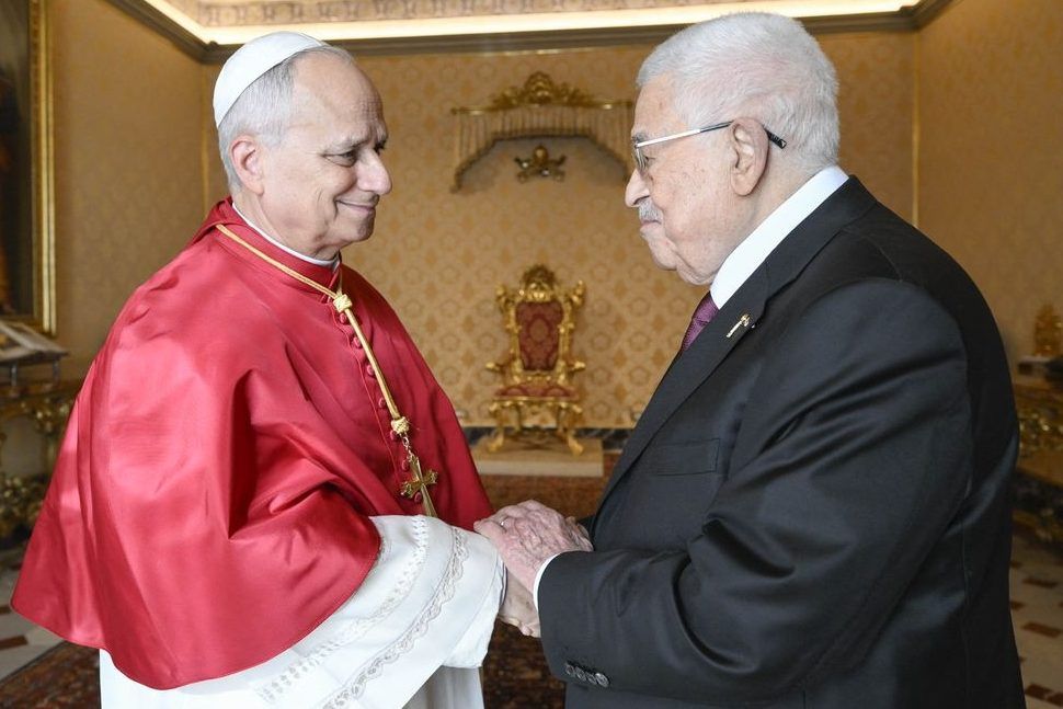 This photo, taken and distributed by The Vatican Media on November 6, 2025, shows Pope Leo XIV meeting with Palestinian President Mahmoud Abbas at the Vatican. 