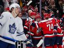 Connor McMichael of the Capitals celebrates with teammates after scoring a goal against the Toronto Maple Leafs during the second period of the game at Capital One Arena on November 28, 2025 in Washington, DC.