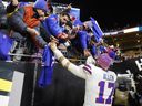 Josh Allen of the Buffalo Bills celebrates with fans after his team's 26-7 victory against the Pittsburgh Steelers at Acrisure Stadium on Sunday, Nov. 30, 2025, in Pittsburgh, Pa.