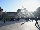 People queue to enter the Louvre museum, Thursday, Oct. 30, 2025 in Paris.