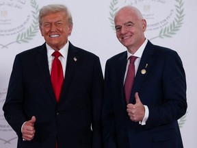 President Donald Trump and FIFA President Gianni Infantino pose for a photograph in Sharm el-Sheikh, Egypt, Monday, October 13, 2025.