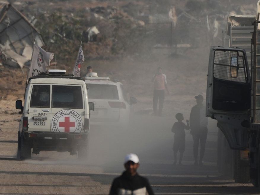 A Red Cross convoy carrying the remains of an Israeli soldier killed in Gaza in 2014 and whose body has been held in Gaza since then heads to the Israeli border crossing for handover to Israeli authorities in Deir al-Balah, Gaza Strip, Sunday, November 9, 2025.
