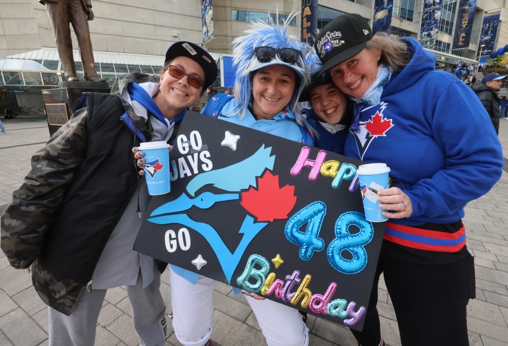  Blue Jays fans (from left to right) Michelle Hines, Laura Comeau, Jasmine Stewart and Erika van Diggelen stood outside the Rogers Centre looking for tickets before Game 7, but instead were off to the watch party at Scotiabank Arena in Toronto, Saturday Nov. 1, 2025.