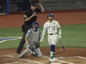 Blue Jays batter Bo Bichette hits a three-run home run in the bottom of the third inning against the Los Angeles Dodgers in Game 7 of World Series in Toronto, Saturday, Nov. 1, 2025.
