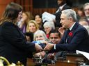 Minister of Finance and National Revenue Francois-Philippe Champagne presents copies of the federal budget at the House of Commons on Parliament Hill in Ottawa on Tuesday, November 4, 2025.