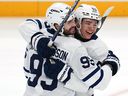 Toronto Maple Leafs Oliver Ekman-Larsson, left, celebrates with Easton Cowan after scoring in the first period against the Penguins in Pittsburgh, Saturday, Nov. 29, 2025.