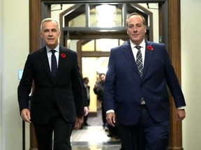 Mark Carney walks with MP Chris d'Entremont