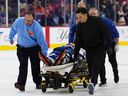 Maple Leafs defenseman Chris Tanev is taken off the ice on a stretcher by medical personnel after a collision during a third-period game against the Flyers in Philadelphia, Saturday, Nov. 1, 2025.