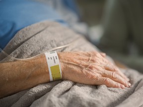 Elderly person in hospital bed