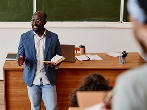 Teacher reading lecture at university