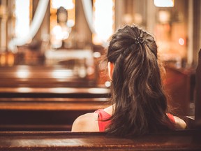 Woman visiting a christian church