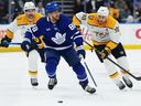 Maple Leafs winger William Nylander (88) is chased by Nashville Predators forwards Filip Forsberg (9) and Ryan O'Reilly (90) during the second period in Toronto on Tuesday, October 14, 2025.
