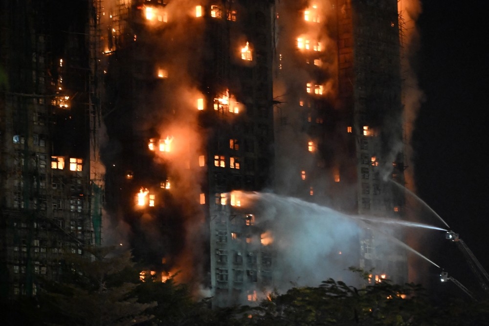  Firefighters spray water during a major fire at the Wang Fuk Court residential estate in Hong Kong’s Tai Po neighbourhood on Wednesday, Nov. 26, 2025.