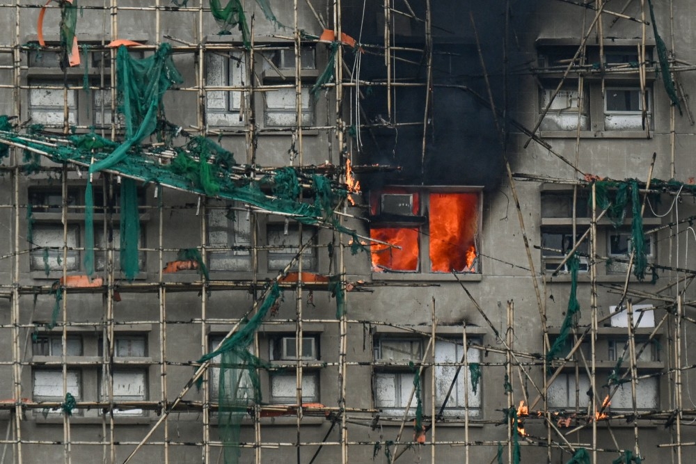  Apartments still burn as a major fire swept through several complexes at the Wang Fuk Court residential estate in Hong Kong’s Tai Po district, Thursday, Nov. 27, 2025.