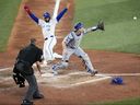 Will Smith #16 of the Los Angeles Dodgers forces Isaiah Kiner-Falefa #7 of the Toronto Blue Jays for the second out during the ninth inning of Game 7 of the 2025 World Series at Rogers Center on Saturday.