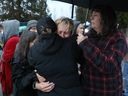 Karen Espersen, the co-owner of Universal Ostrich Farms, embraces her daughter, Katie Pasitney, at the farm in Edgewood, B.C., following the announcement that the Supreme Court dismissed the farm’s appeal to stay an order to cull more than 300 of its ostriches, Thursday, Nov. 6, 2025.