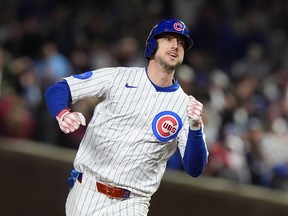 Kyle Tucker of the Chicago Cubs runs around the bases after hitting a home run.
