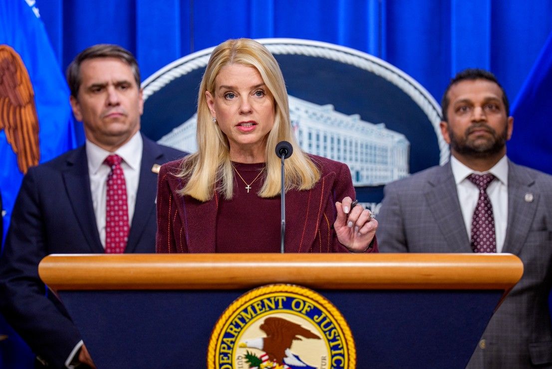 Attorney General Pam Bondi, accompanied by Deputy Attorney General Todd Blanche (L) and FBI Director Kash Patel (R), speaks during a news conference at the Justice Department in Washington, DC, where a $15M reward is offered for information leading to the arrest of Ryan James Wedding, the leader of an international criminal drug organization, on Nov. 19, 2025.