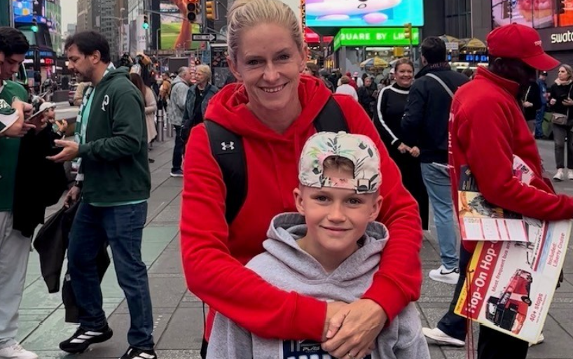  Brampton teacher Lindsay MacOdrum, 41, of Rockwood, Ont., is pictured in Times Square with her younger son, Tommy, 9, before she suffered cardiac arrest in Central Park a short while later on a bike ride with her family. Her stepson, Maddox, 17, did CPR right away, effectively saving her life. (Lindsay MacOdrum/Handout)