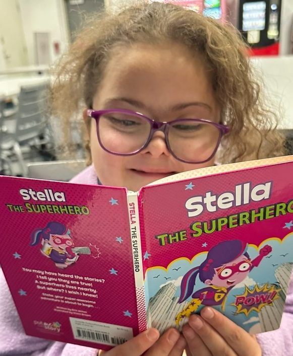 Stella Leblanc-Beaudoin, 9, seen here with her new favourite book, recently helped kick off the annual Sun Christmas Fund at Variety Village.