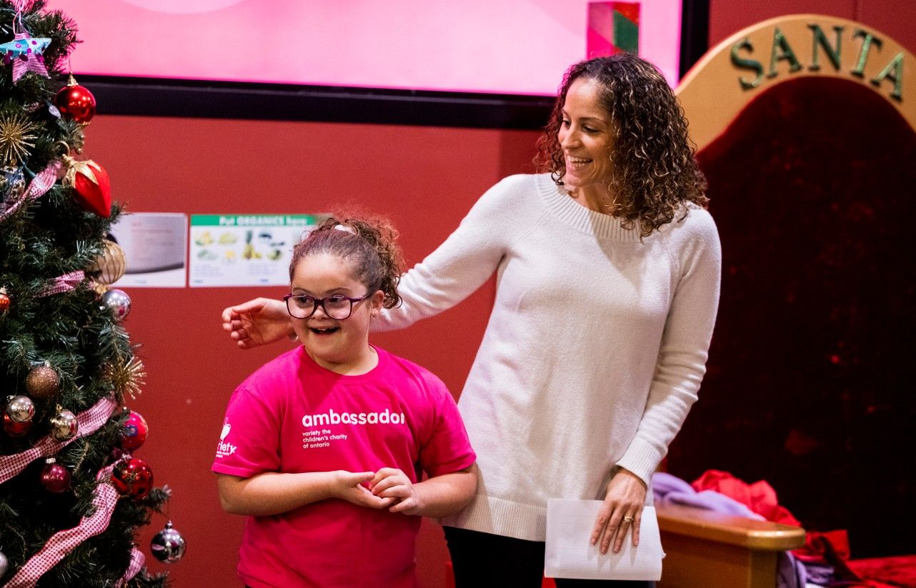 Christina Guzzo with her daughter Stella Leblanc-Beaudoin during the kickoff to the Sun Christmas Fund at Variety Village in Toronto on Wednesday, Nov. 12, 2025.