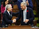 Finance Minister Francois-Philippe Champagne shakes hands with Prime Minister Mark Carney after his Budget speech in the House of Commons on November 4, 2025. (The Canadian Press, Sean Kilpatrick)
