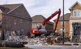A demolition crew is pictured Monday at a home on Banas Way, McLaughlin Renovations Roads. The area affected by the deadly fire on November 20. Five people died, the rest are in hospital with serious injuries. (Ernest Doroshuk, Toronto Sun)