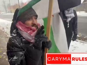 Anti-Israel marcher, wearing a red keffiyeh, tells off a resident of a Jewish neighbourhood on Sunday, telling her "Zionist, you don't own this"